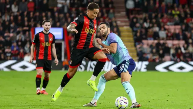 Mikel Merino tackles Marcus Tavernier of Bournemouth