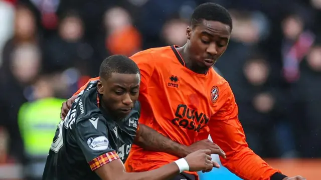 Motherwell's Tawanda Maswanhise and Dundee United's Emmanuel Adegboyega