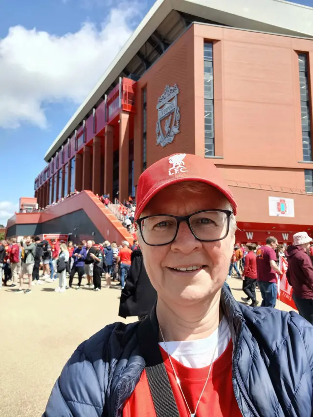 Liverpool fan outside Anfield