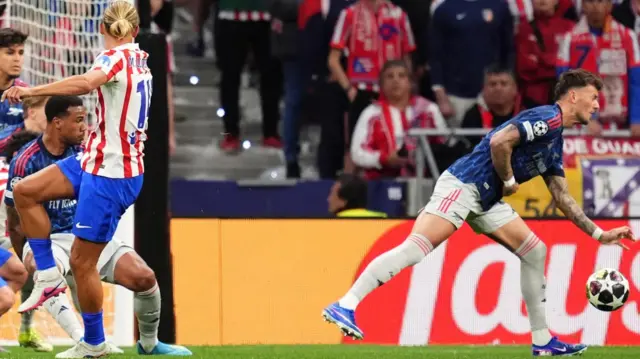 A shot from Atletico Madrid's Marcos Llorente shits the hand of Arsenal's Ben White resulting in a penalty 
