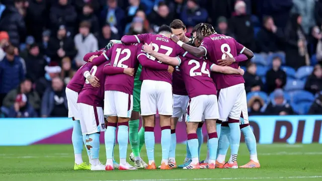 Burnley team in a huddle