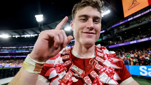 Tommy Freeman wearing a home-made garland
