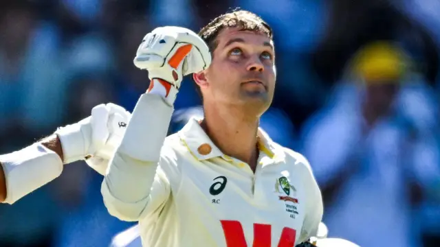 Australia wicketkeeper Alex Carey looks to the skies to dedicate his century to his late father