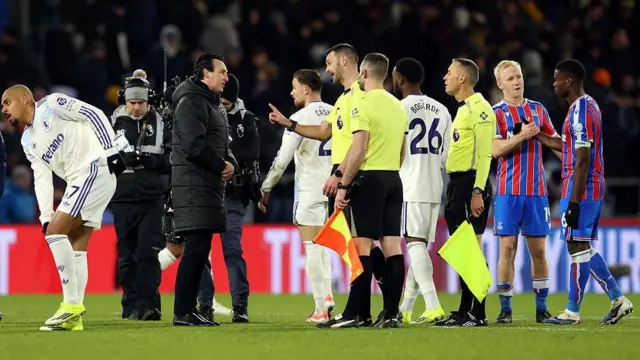 Unai Emery, manager of Aston Villa, remonstrates with referee Andy Madley