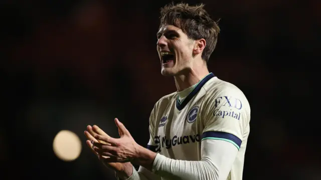 Caleb Taylor celebrates the win at full time