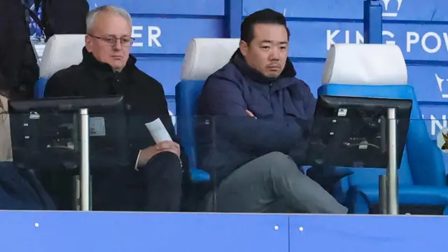 Leicester City chairman Aiyawatt Srivaddhanaprabha (right) and director of football Jon Rudkin look unimpressed as they watch the defeat to Oxford United