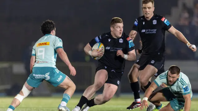 Johnny Matthews carries for Scotland against Munster