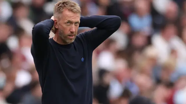 Graham Potter with his hands on his head