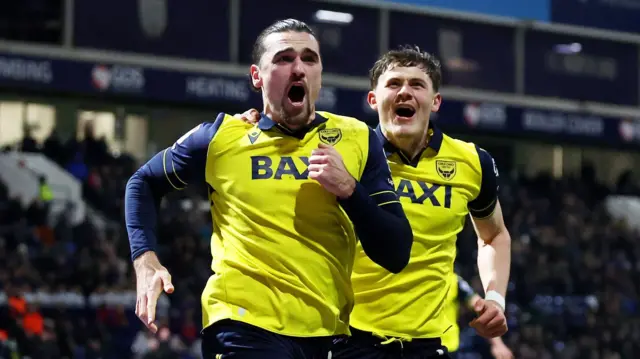 Oxford United's Ciaron Brown (L)