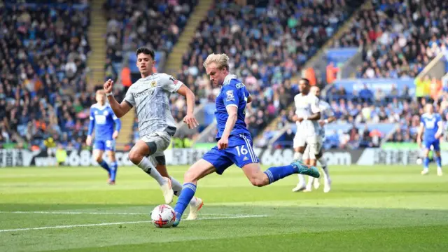 Victor Kristiansen of Leicester City with Matheus Nunes of Wolverhampton Wanderers during the Premier League match between Leicester City and Wolverhampton Wanderers at King Power Stadium on April 22, 2023