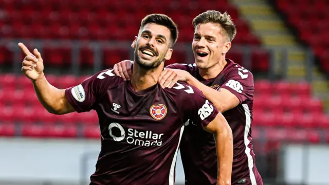 Claudio Braga celebrates with Cammy Devlin