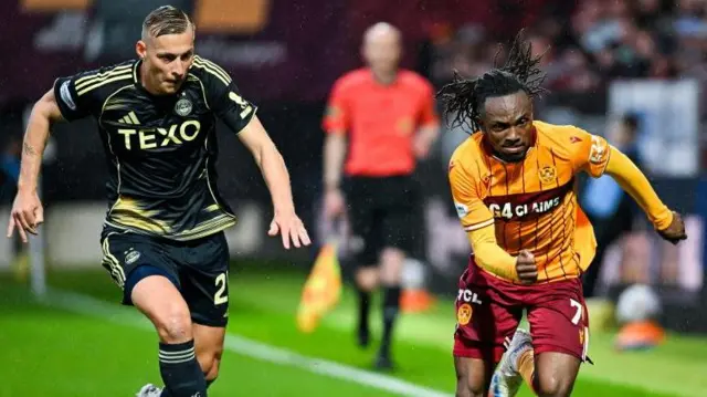 Aberdeen's Kristers Tobers and Motherwell's Regan Charles-Cook 