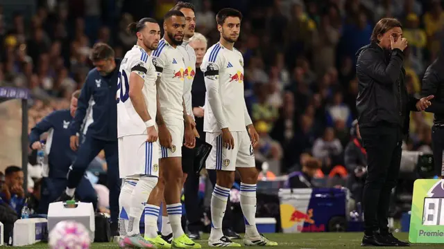 Jack Harrison waits to come on as a substitute with Lukas Nmecha and Ilia Gruev 