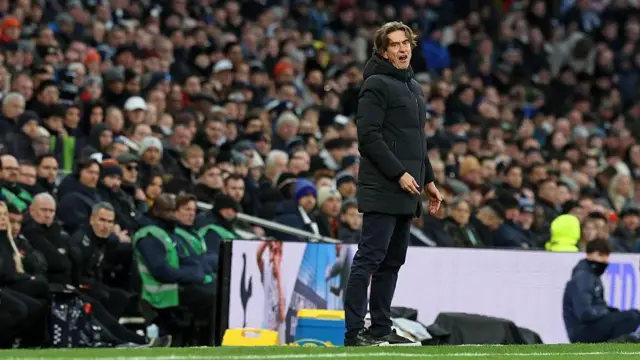Spurs head coach Thomas Frank looks on from the touchline 