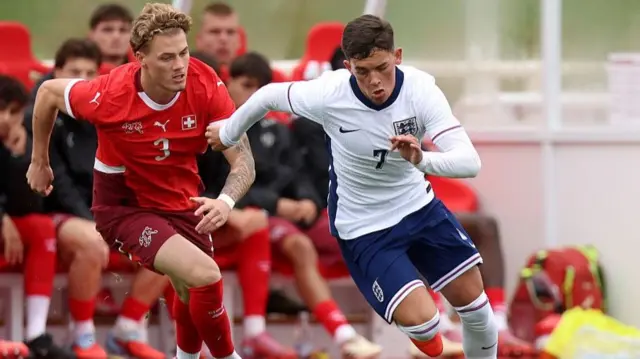 England winger Shea Lacey takes on the Switzerland defence during the 1-0 Under-20 international defeat at St George's Park