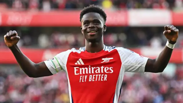 Bukayo Saka celebrates