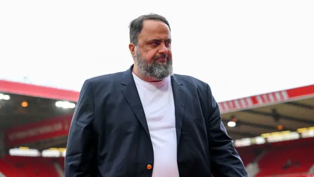 Evangelos Marinakis inside the City Ground with the stands out of focus in the background