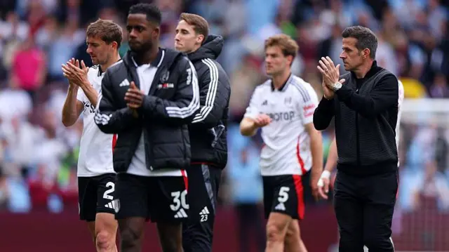 Fulham manager Marco Silva and his players applaud the travelling fans following the Cottagers' 1-0 defeat at Aston Villa