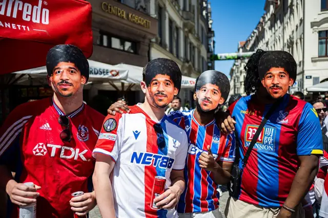 Crystal Palace fans wear Chris Richards masks