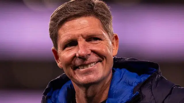 Crystal Palace manager Oliver Glasner looks happy