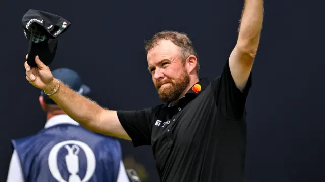 Shane Lowry waves at fans on the 18th hole at Royal Portrush