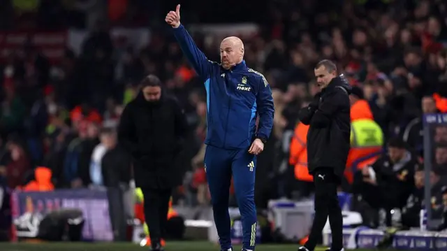 Sean Dyche gives a thumbs up on the touchline