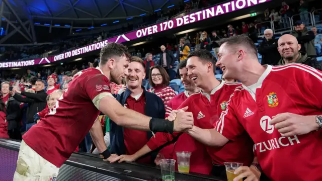 British and Irish Lions' Hugo Keenan with fans and family after the game