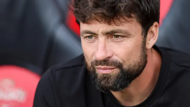 Southampton manager Russell Martin sits in the dugout