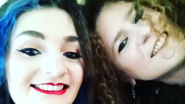 A close up shot of two women smiling