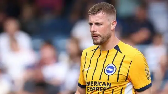 Adam Webster of Brighton & Hove Albion looks on during a pre-season friendly match between Queens Park Rangers and Brighton & Hove Albion at Loftus Road