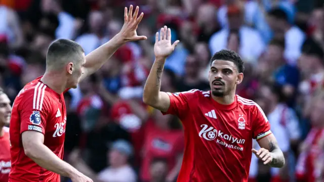 Morgan Gibbs-White high-fives team-mate after scoring