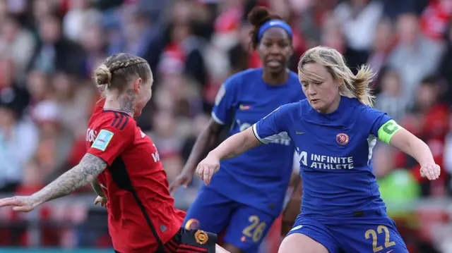 Erin Cuthbert of Chelsea takes on Leah Galton of Manchester United