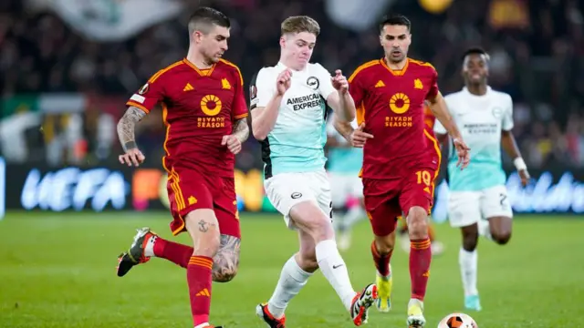 Evan Ferguson of Brighton battles for possession with Roma's Gianluca Mancini during a Europa League last-16 tie