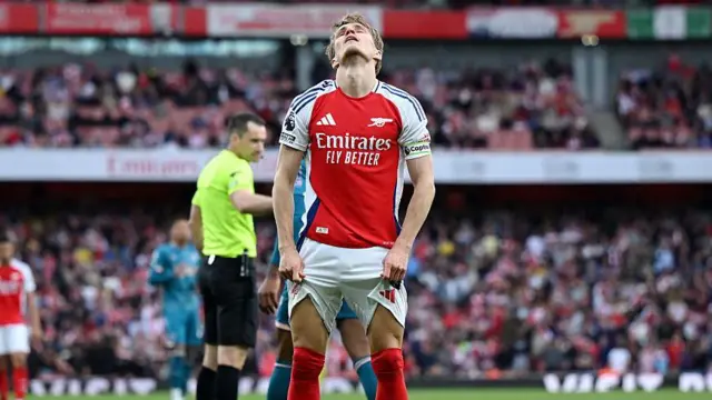 Martin Odegaard playing for Arsenal