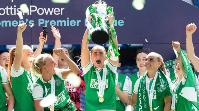Kathleen McGovern lifting SWPL trophy