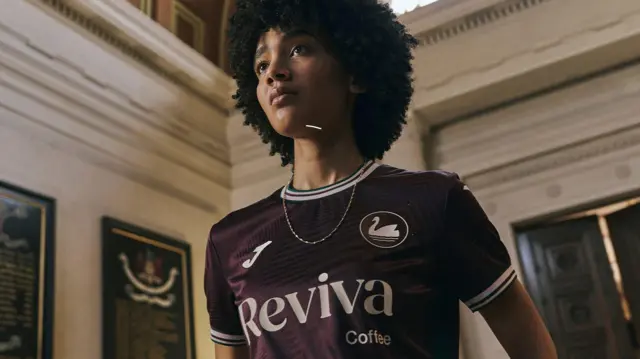 Swansea's new away shirt worn by a model