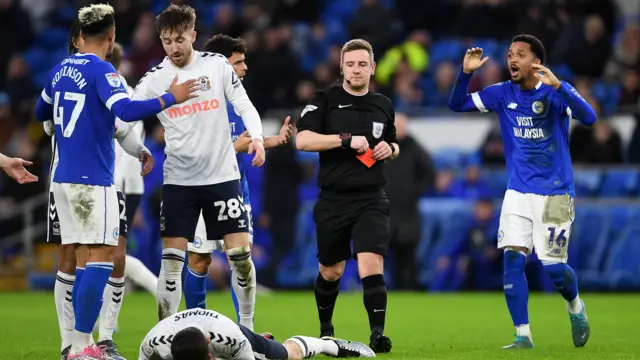 Callum Robinson is shown a red card v Coventry City 