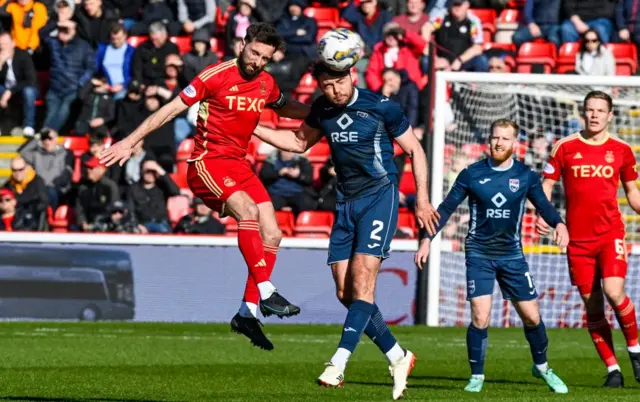 Aberdeen's Graeme Shinnie and Ross County's Connor Randall in action during a cinch Premiership match between Aberdeen and Ross County at Pittodrie Stadium, on March 30, 2024, in Aberdeen, Scotland.