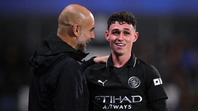 Pep Guardiola and Phil Foden