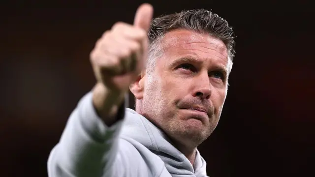 Wolves head coach Rob Edwards puts his thumb up