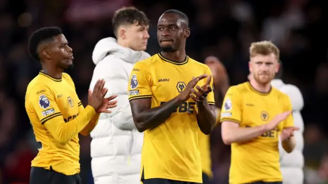 Toti Gomes of Wolverhampton Wanderers applauds the fans at full-time following the team's defeat in the Premier League match between Wolverhampton Wanderers FC and Liverpool FC at Molineux