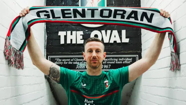 Shane McEleney with Glentoran scarf