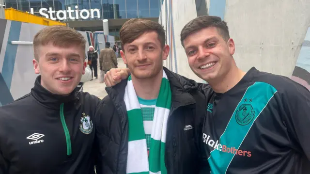 Shamrock Rovers supporters Tiernan Stynes, Cian Hassett and Josh Ward arrive at Belfast's Grand Central Station from south Dublin ahead of their club's Europa Conference League game against Larne.