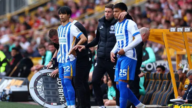 Kaoru Mitoma of Brighton & Hove Albion prepares to come on as a substitute during the Premier League match between Wolverhampton Wanderers FC and Brighton & Hove Albion FC at Molineux.