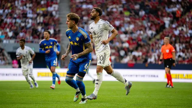 Matheus Cunha of Manchester United in action with Joe Rodon of Leeds