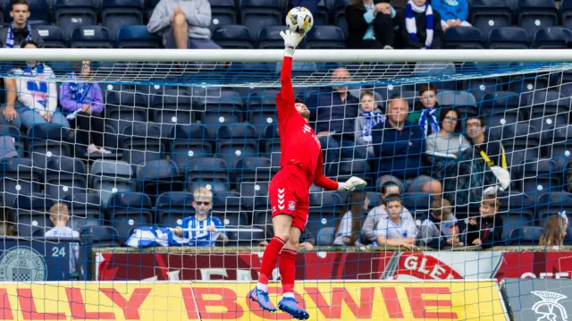 KILMARNOCK, SCOTLAND - SEPTEMBER 01: Kilmarnock goalkeeper Kieran O'Hara makes a save during a William Hill Premiership match between Kilmarnock and Hibernian at Rugby Park, on September 01, 2024, in Kilmarnock, Scotland.