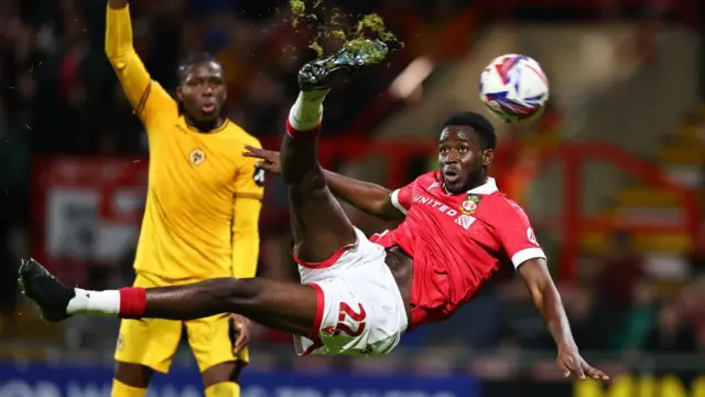 Mo Faal scores acrobatically against Wolves U21s in the EFL Trophy