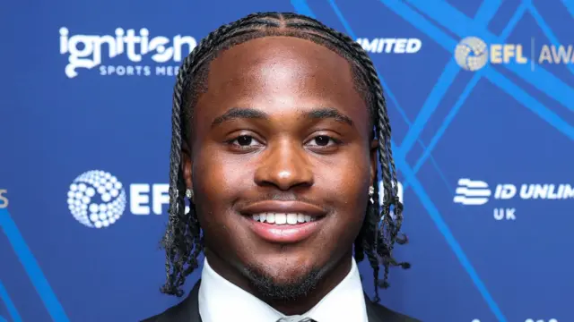 Sheldon Kendall, of Millwall, smiling while wearing a suit before an awards dinner