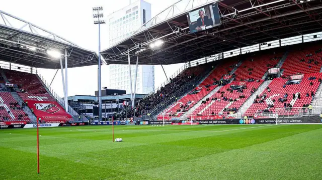 Stadion Galgenwaard shot from the pitch inside, looking at two stands with red seats.