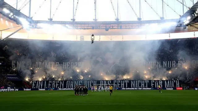 Frankfurt fans with a tifo and flairs at Deutsche Bank Park